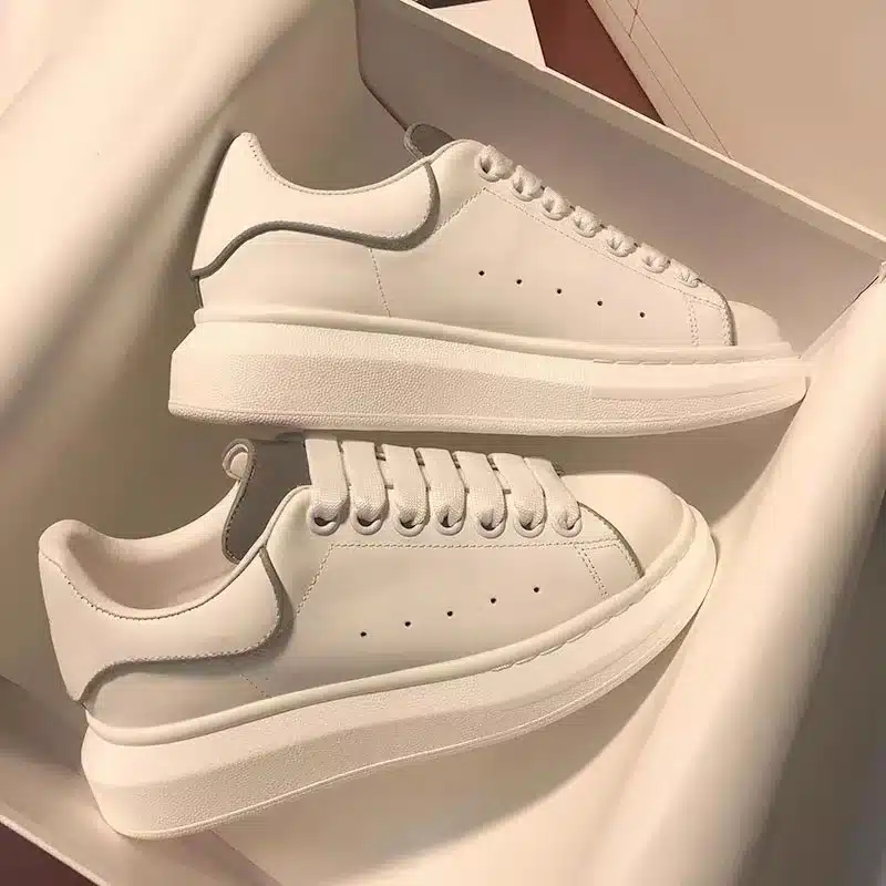 White minimalist platform sneakers perfect for casual style, versatile and trendy footwear.