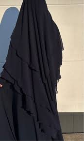 Elegant black abaya with layered design, modest Islamic fashion for women.